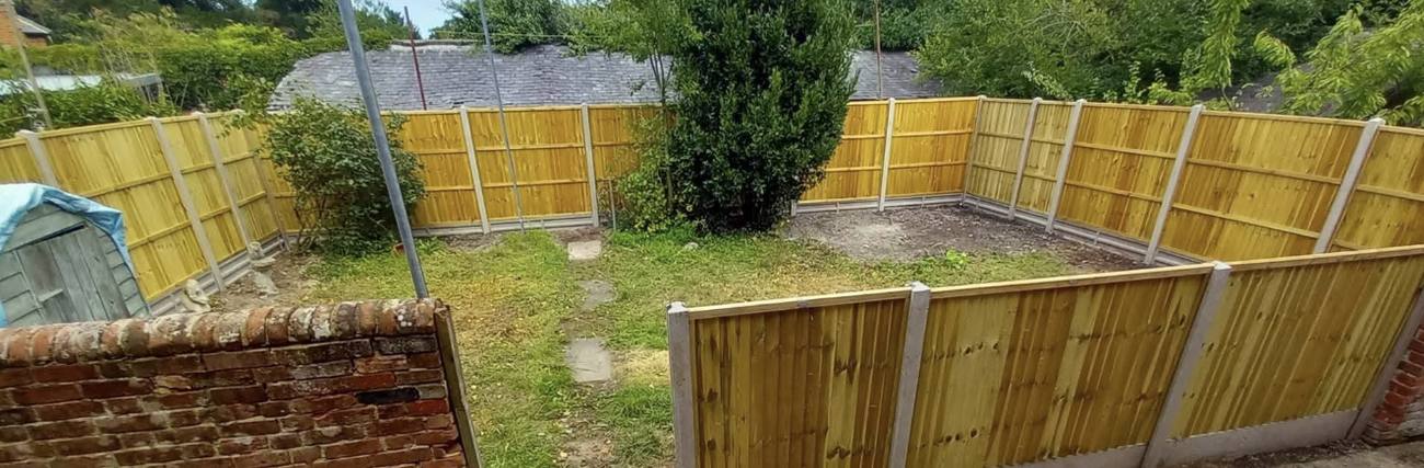 New closeboard fencing around a full boundary, Kent