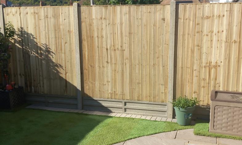 New closeboard fence panels with artificial lawn, Kent