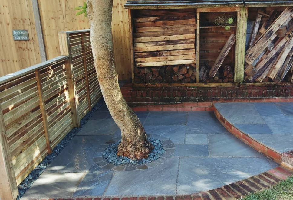New porcelain patio path and fresh lawn installed by Lawn Ranger Landscapes