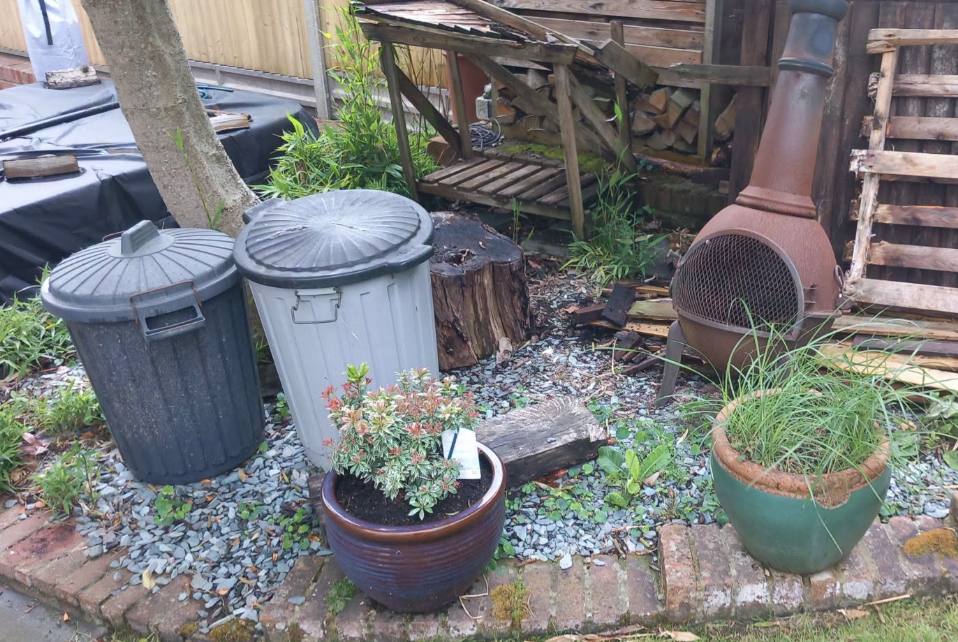 Worn old paving slabs before a new patio in Kent