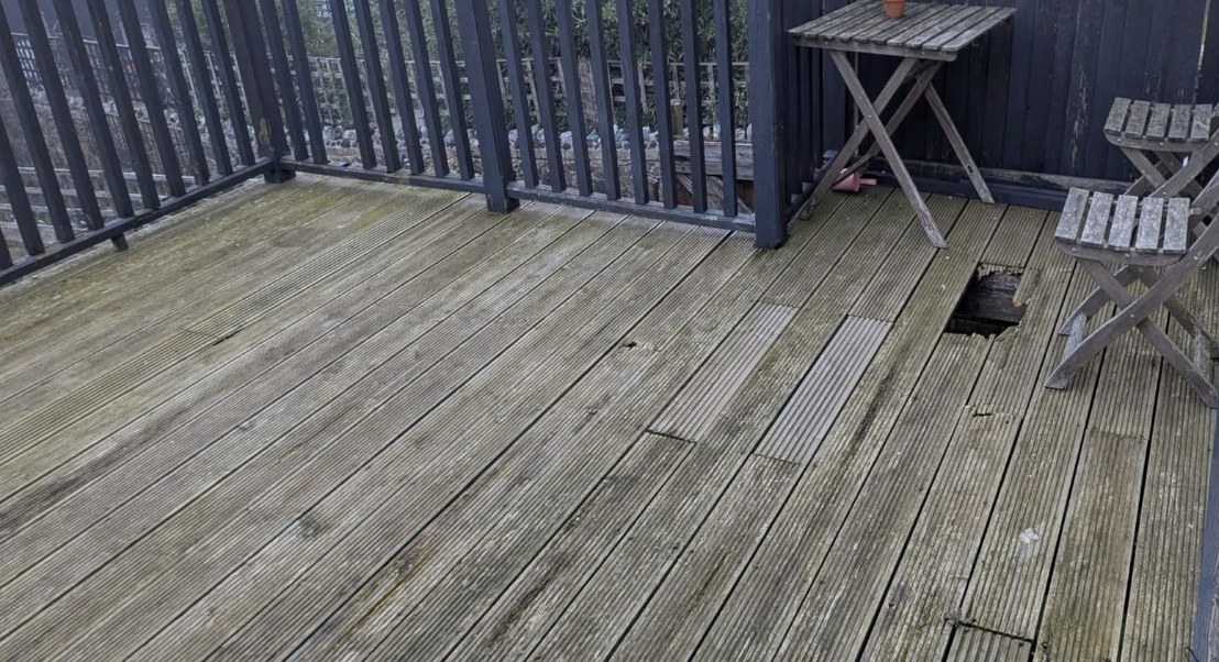 Old rotten and mossy decking boards before replacement in Kent